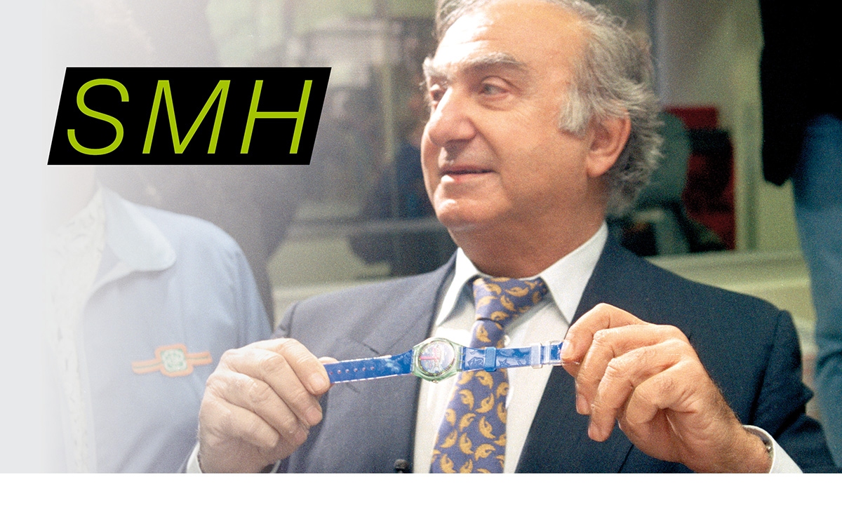 picture of Nicolas G. Hayek holding a Swatch